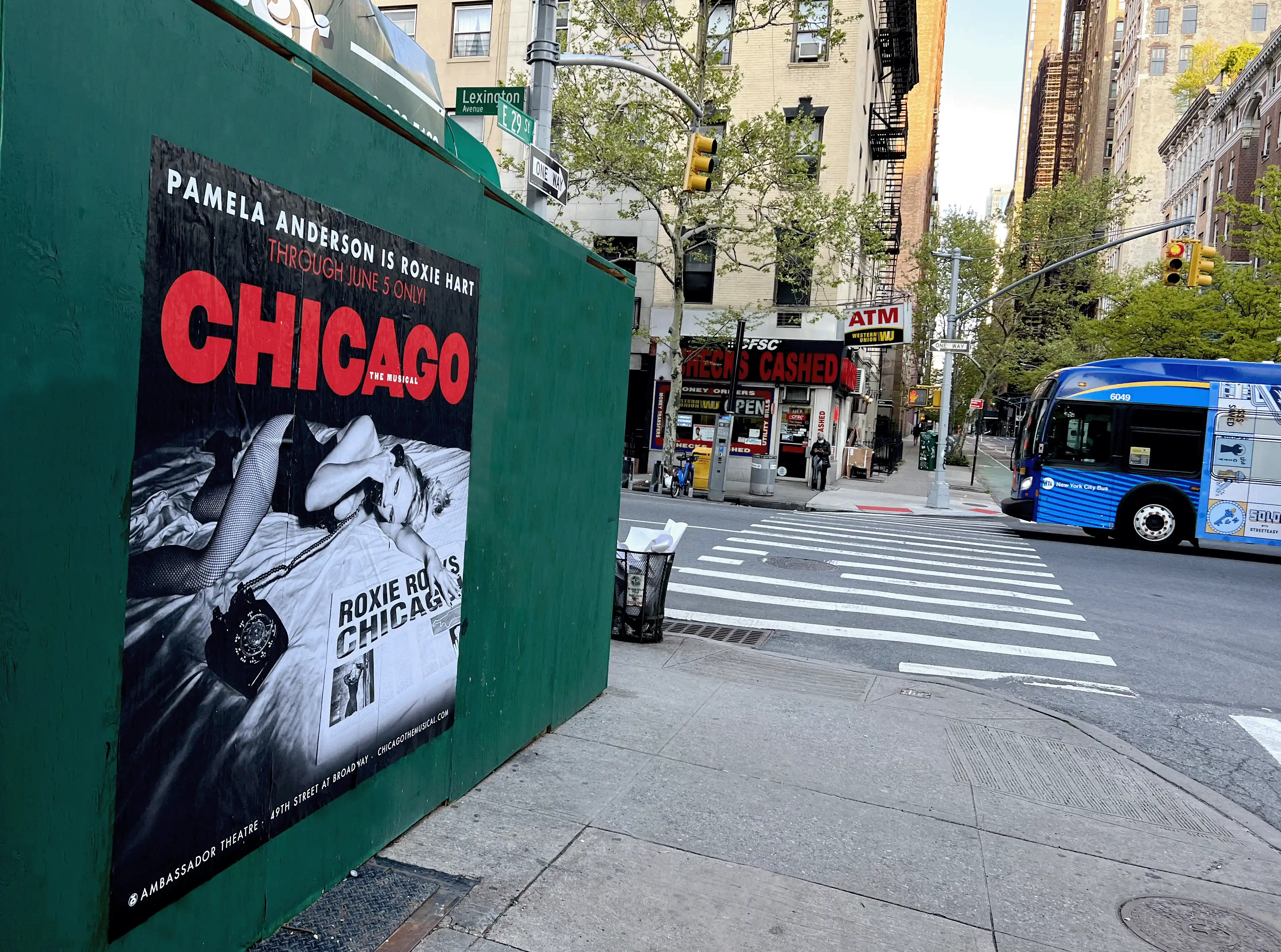 Wild posting advertisement of Broadway show Chicago on the corner of Lexington Ave and 29th street in Manhattan