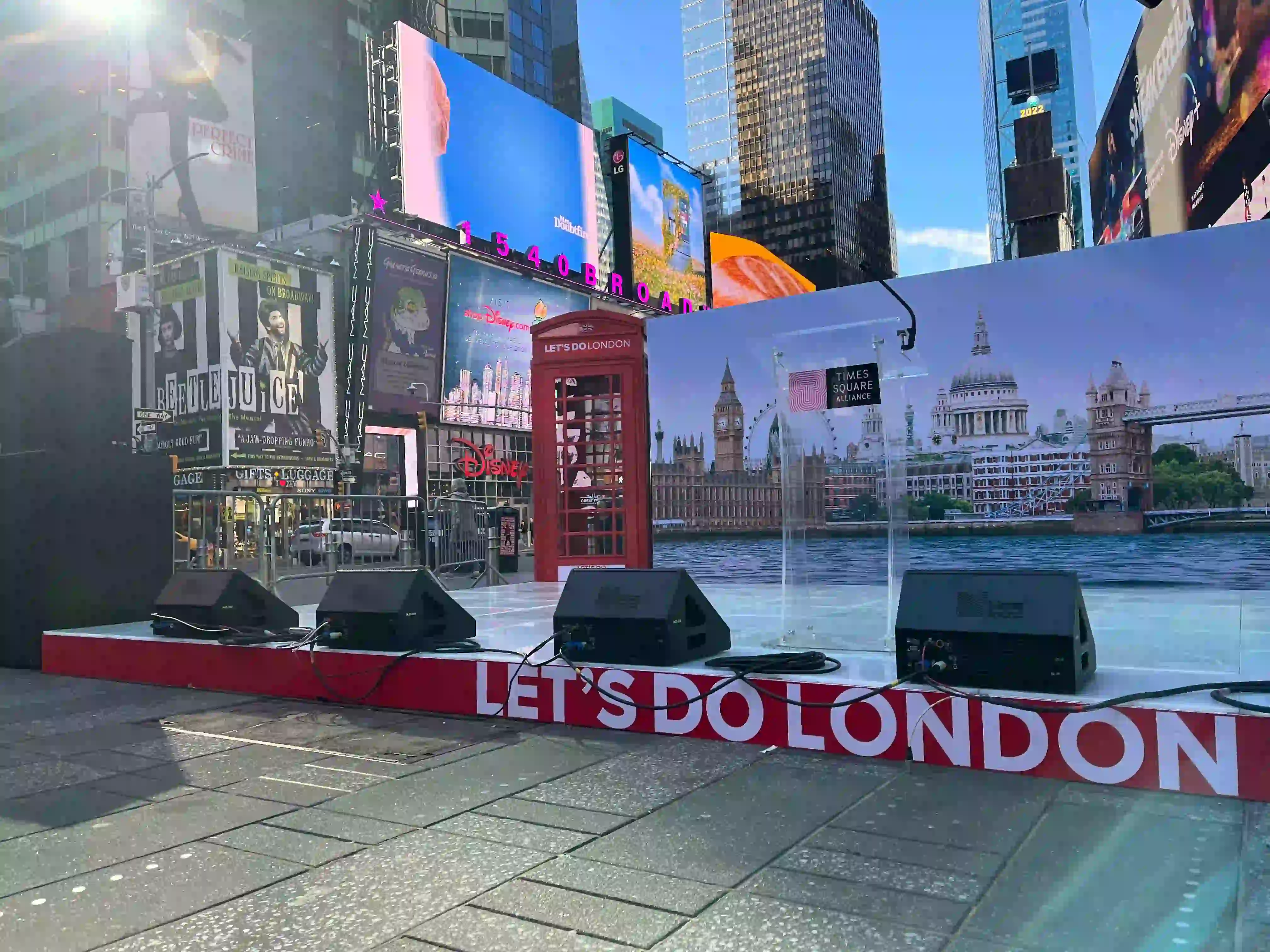 Lets do London sign in times square with red telephone box for experiential event.