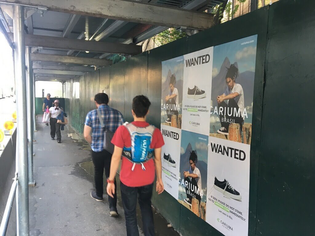 Cariuma wild postings on a construction walkway