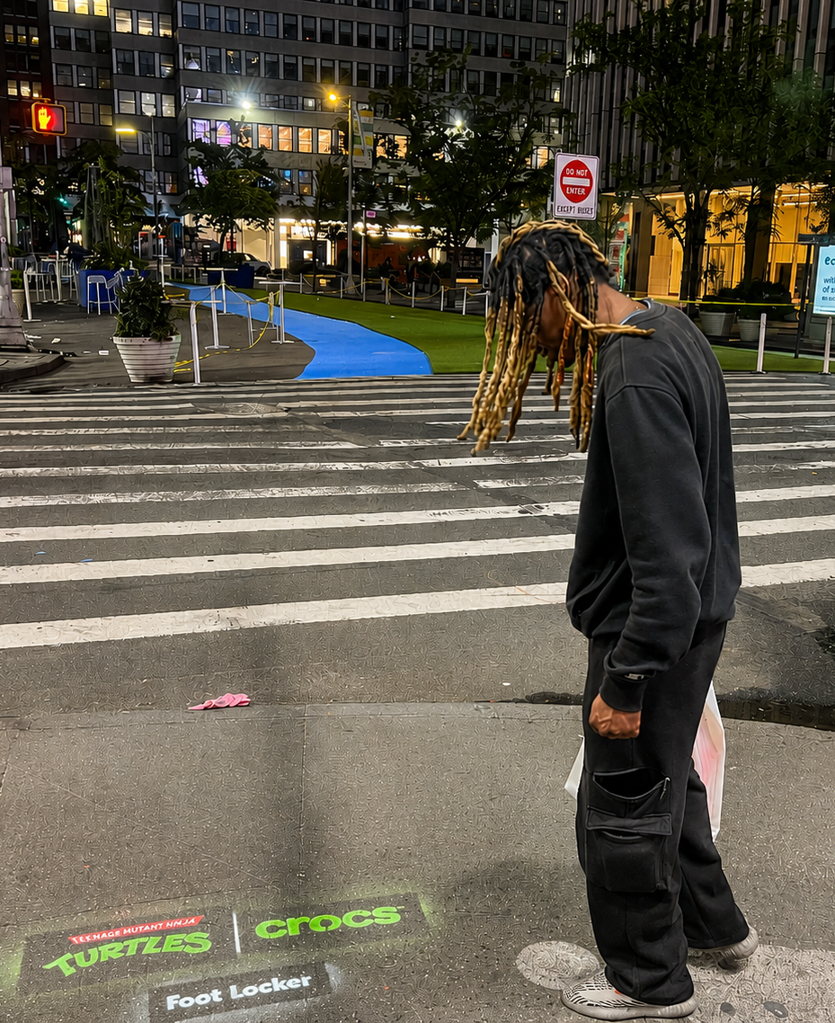 Man with chalk stencils on the street