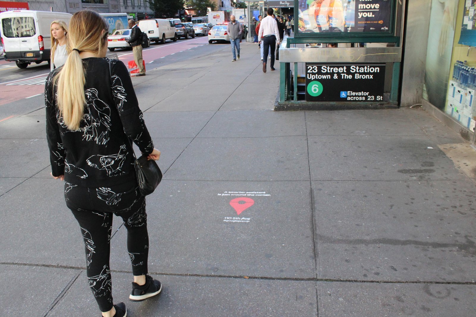 Google pop-up chalk stencil by a subway entrance