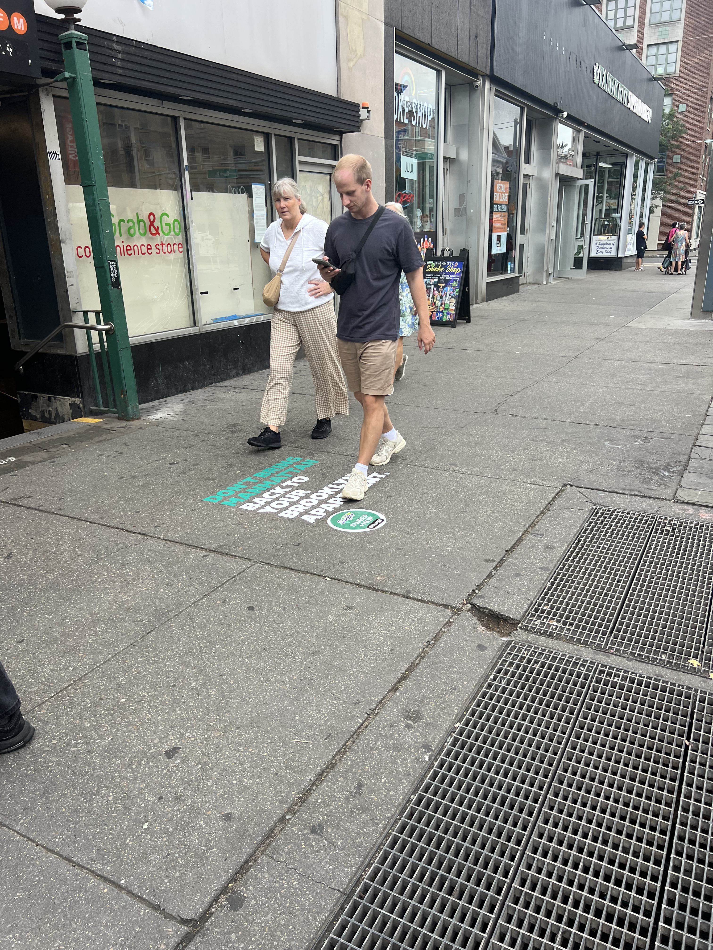 Swiffer chalk stencil with person walking by