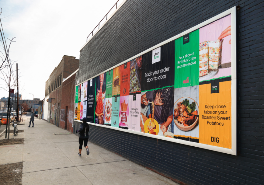 Uber Eats wild postings on a city wall